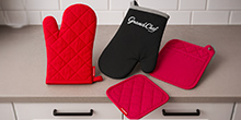 Oven mitts, heat-proof mats, cloths and cooking aprons